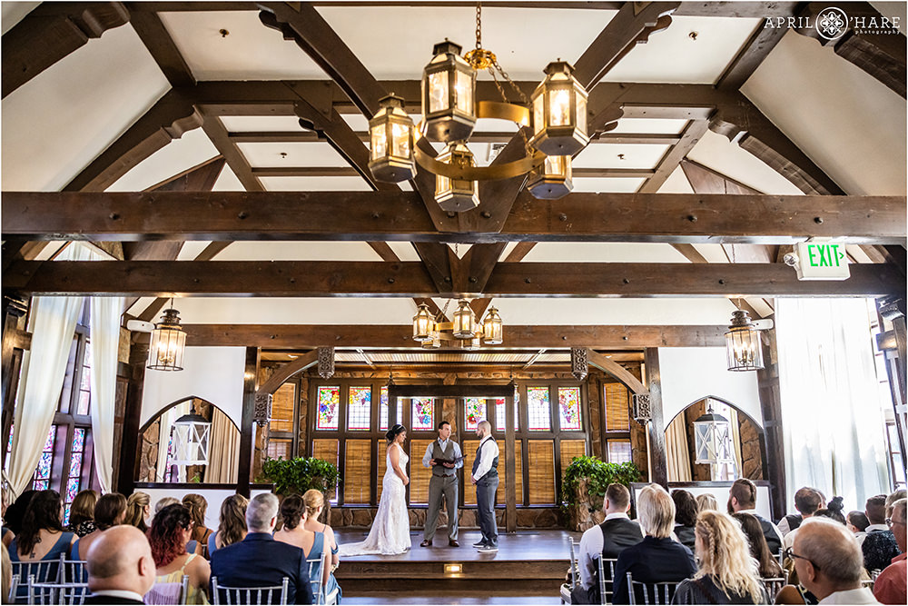 Wide angle view of indoor wedding ceremony at Wellshire Event Center in Denver