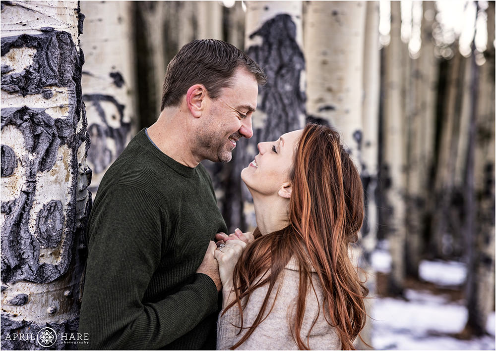 Pretty engagement photo in the aspen trees on Squaw Pass Road in Evergreen CO