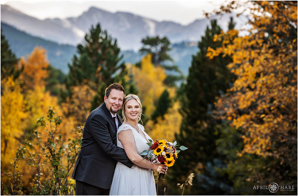Gorgeous Fall Color Wedding Portrait with Longs Peak Mountain Backdrop at Romantic Riversong Inn in Estes Park Colorado