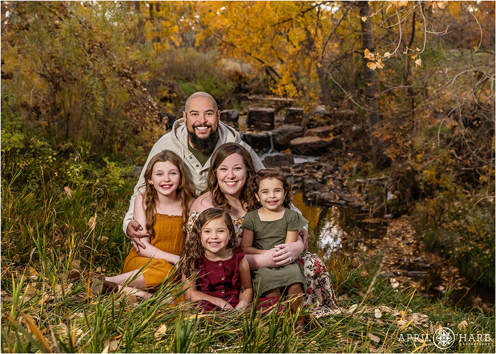 Fall Color Autumn Family Photos at James Bible Park with small waterfall backdrop
