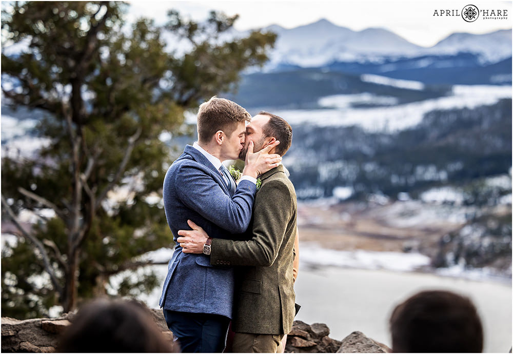 Ceremony kiss at an outdoor gay wedding at Sapphire Point in Colorado