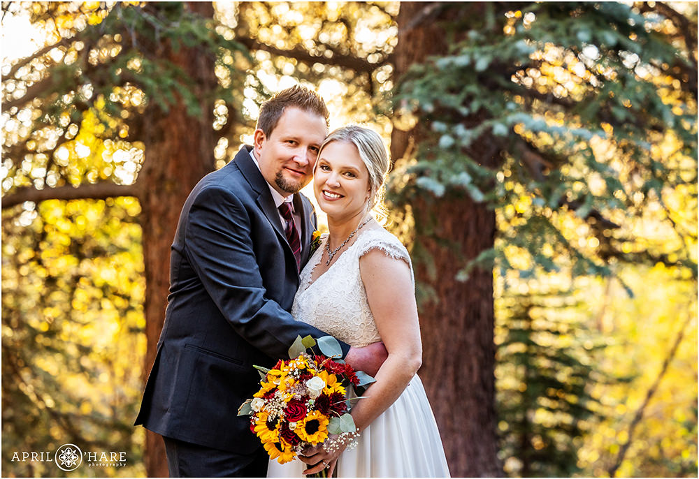 Beautiful wedding portrait with fall color backdrop at Romantic Riversong Inn in Estes Park CO