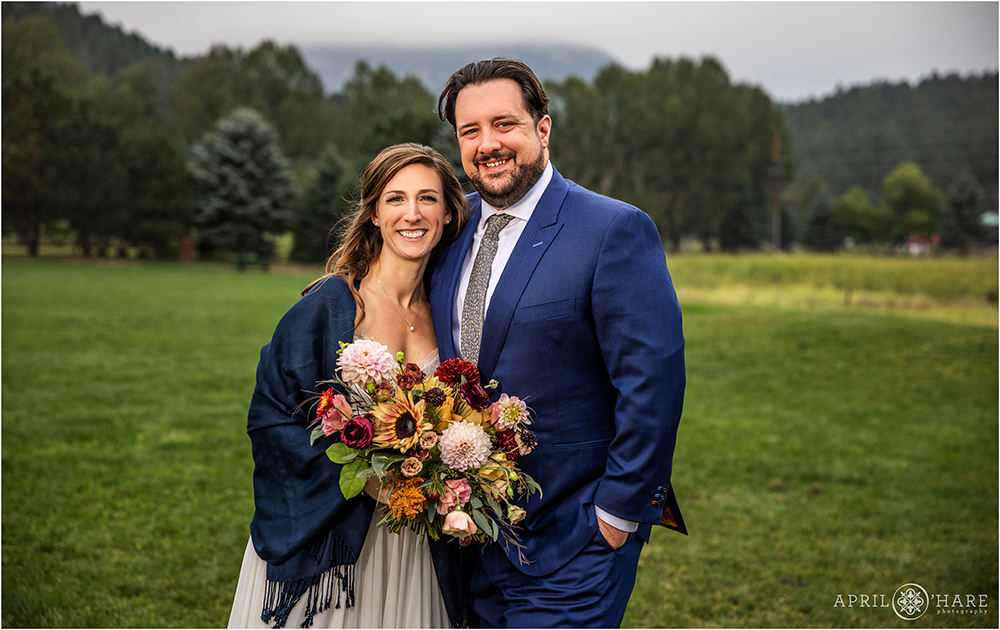 Beautiful wedding couple portrait on a chilly fall wedding day at Evergreen Lake House