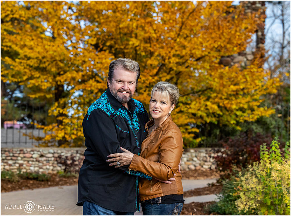 Beautiful fall tree backdrop for a couples portrait at Highlands Ranch Mansion