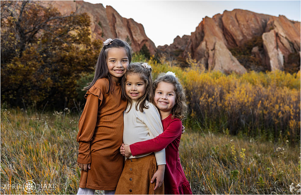 3 young sisters at Roxborough State park during Autumn in Colorado