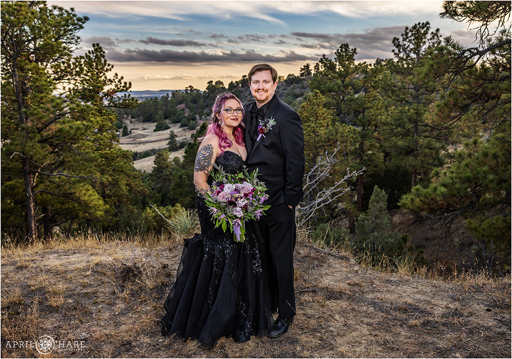 Bride and Groom pose together at Once Upon a Time Farm wedding venue in Kiowa Colorado