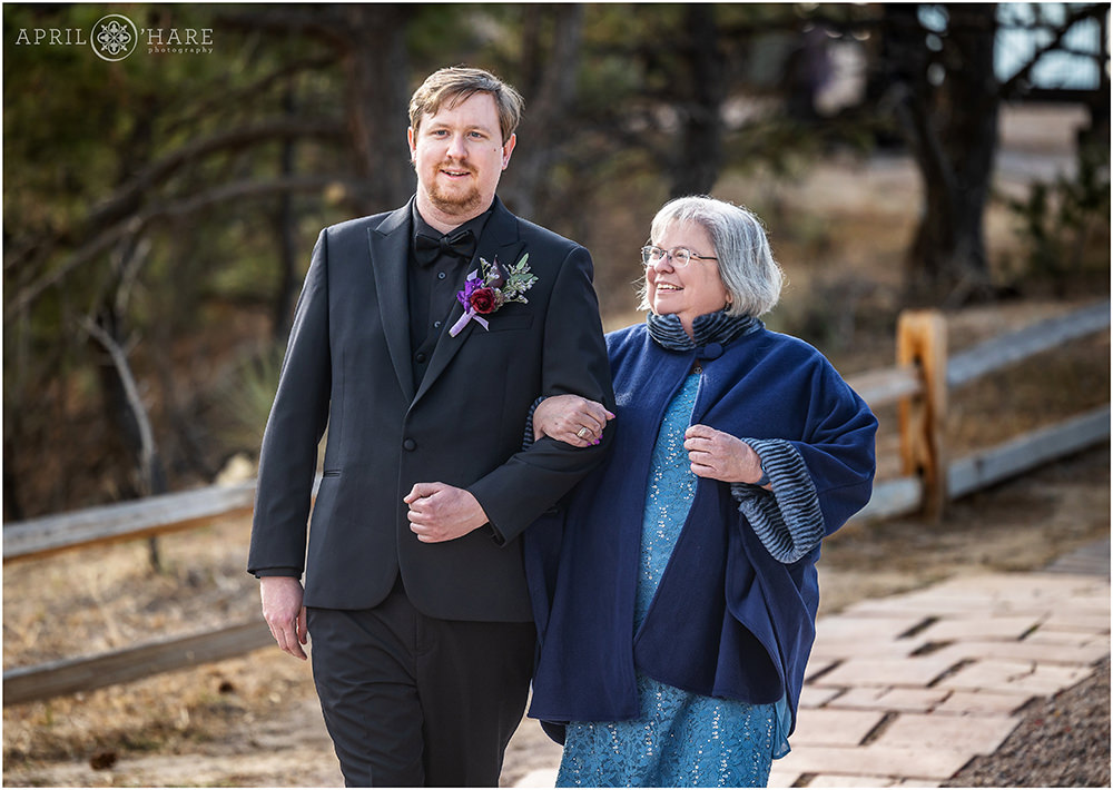 Groom and his mom walk down the aisle at Once Upon a Time