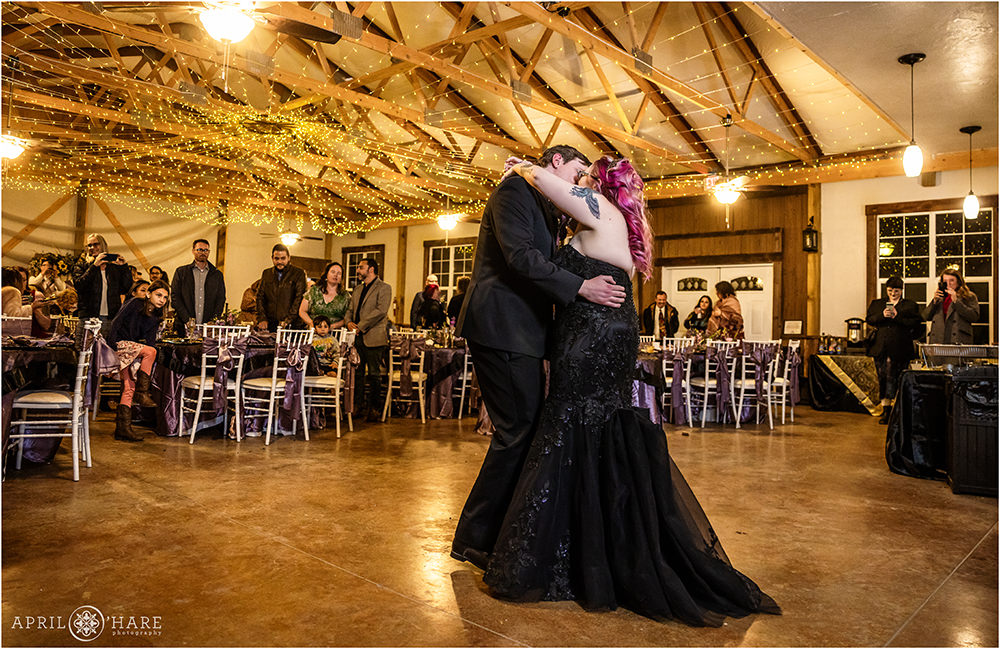 Couple kiss during their first dance at Once Upon a Time in Kiowa CO