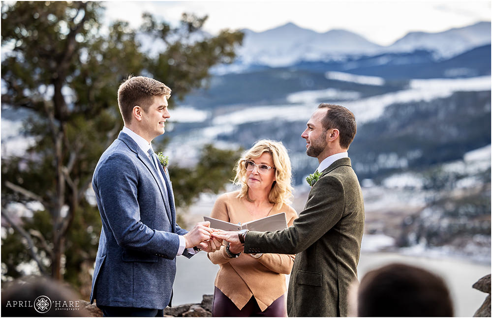Ring exchange at an outdoor gay wedding at Sapphire Point