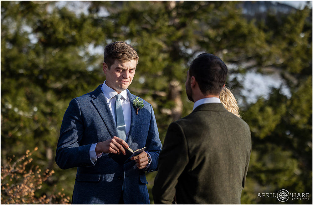 Groom gets emotional as he says his vows at an outdoor wedding ceremony at Sapphire Point