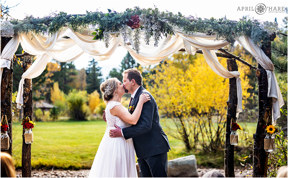 Wedding kiss at Romantic Riversong Inn in Estes Park Colorado