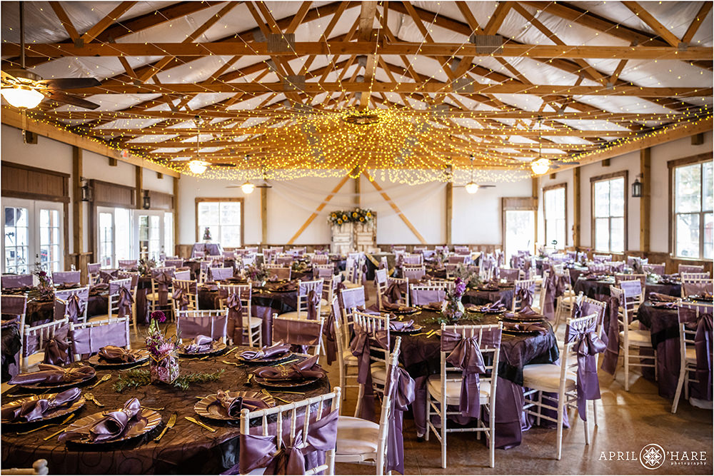 Indoor barn reception space decorated with purple at Once Upon a TIme in Kiowa CO