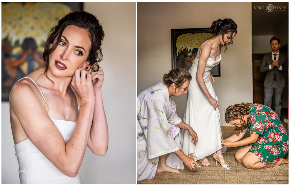 Bride gets help with her dress on her wedding day in a room at Table Mountain Inn in Golden CO