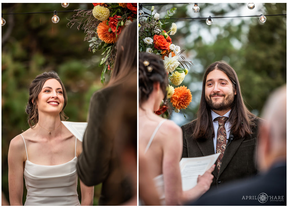 Cute couple smile at each other as they say their vows at their woodsy wedding ceremony at Boettcher Mansion in Colorado
