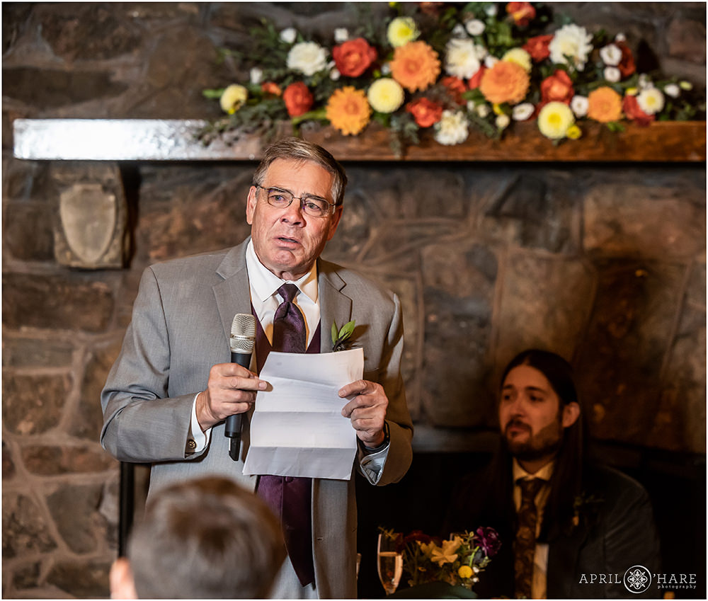 Bride's father gives a toast on the day of his daughter's wedding at Boettcher Mansion in Colorado