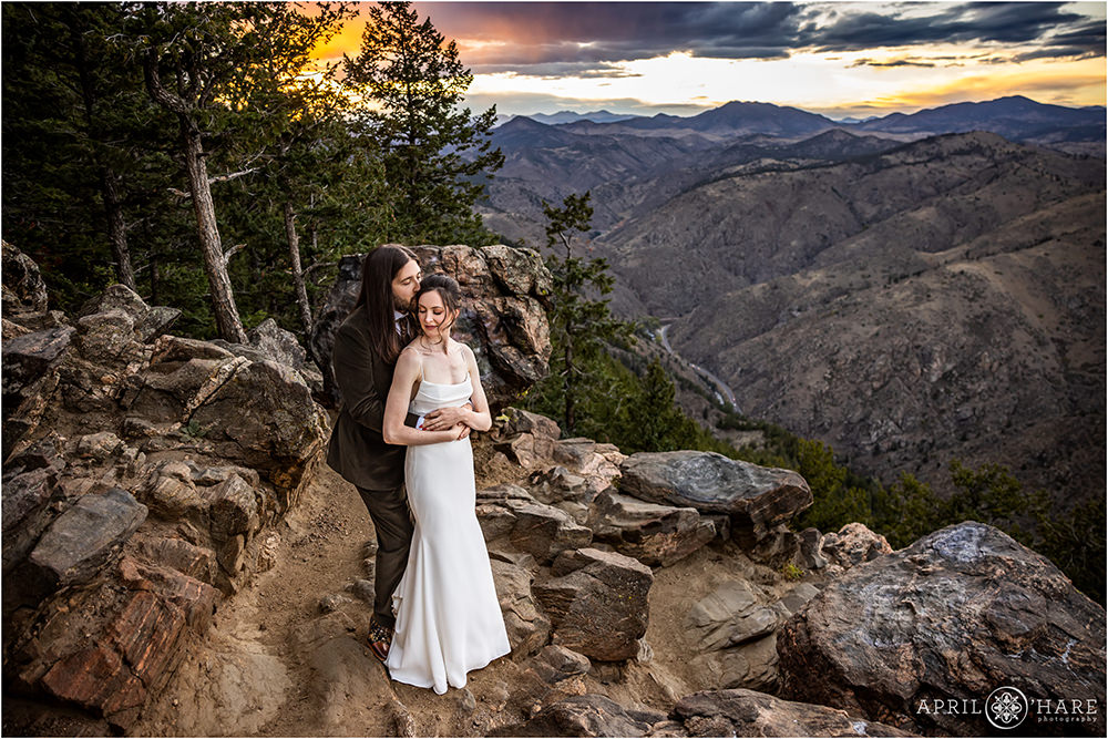 Stunning mountain backdrop at sunset makes for a gorgeous wedding day portrait at Boettcher Mansion in Colorado