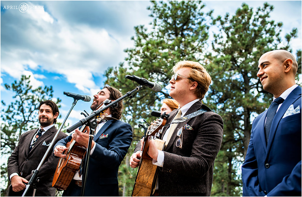 Groom's band mates play music for his wedding ceremony at Boettcher Mansion in Colorado