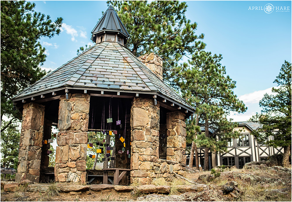 The stone gazebo decorated with seating chart assignments at Boettcher Mansion in Golden CO