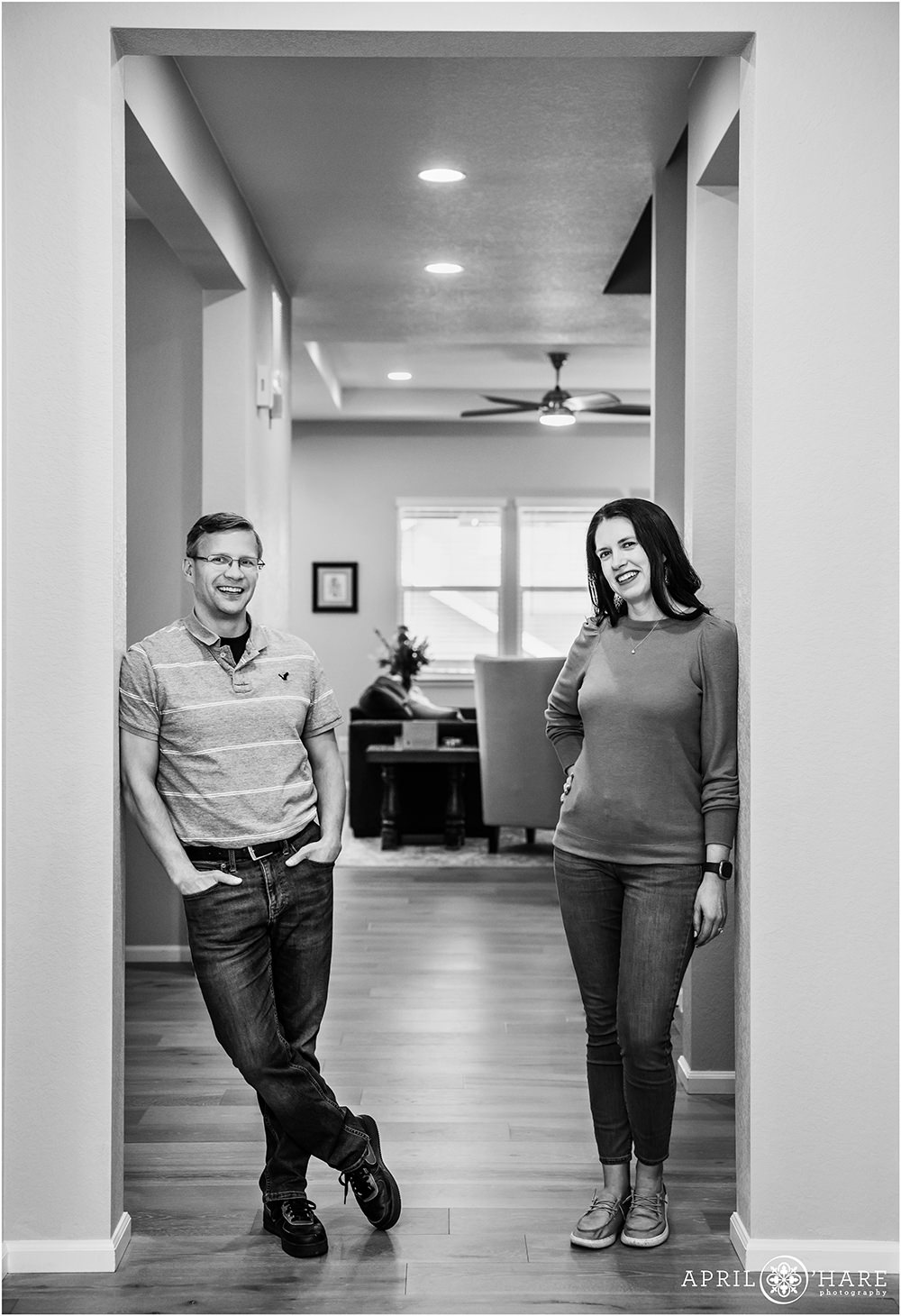 B&W photo of a couple in their hallway at their new home in Littleton Colorado
