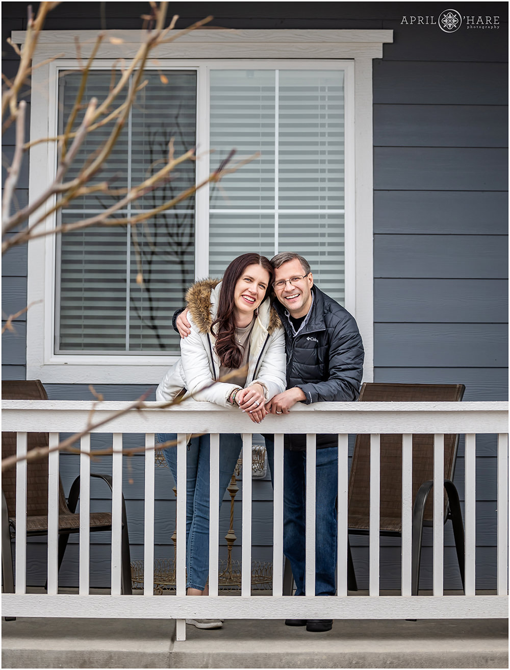 Couple portraits on their front porch at the new home in Littleton Colorado