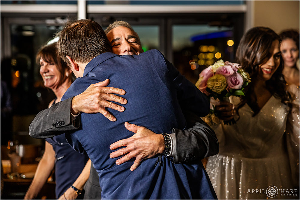 Groom hugs his new father in law at his wedding at Coohills
