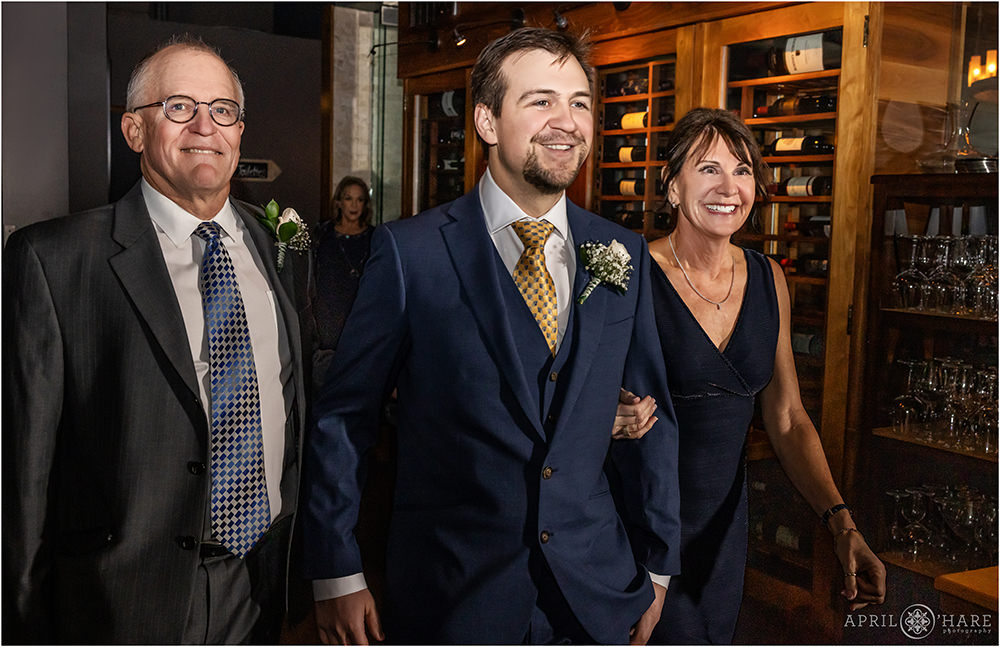 Groom with his parents at his intimate NYE wedding celebration in Denver CO