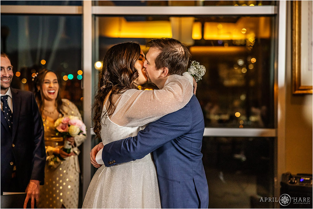 Wedding ceremony kiss at Coohills restaurant in Downtown Denver