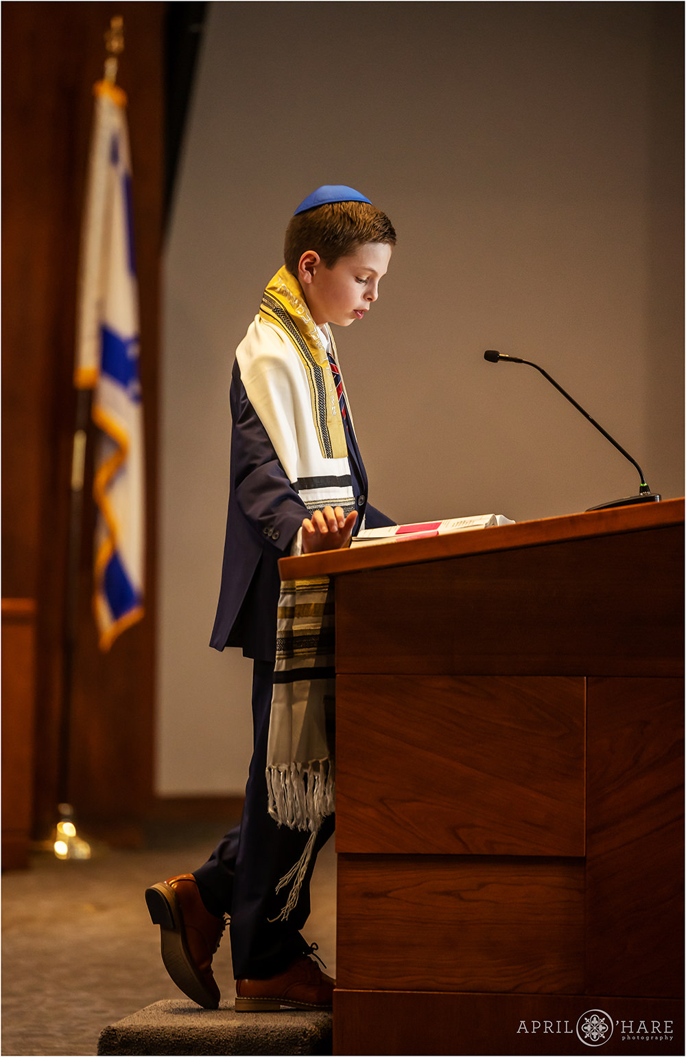 Bar mitzvah boy practices his readings in preparation for his bar mitzvah service at Temple Sinai in Denver, CO