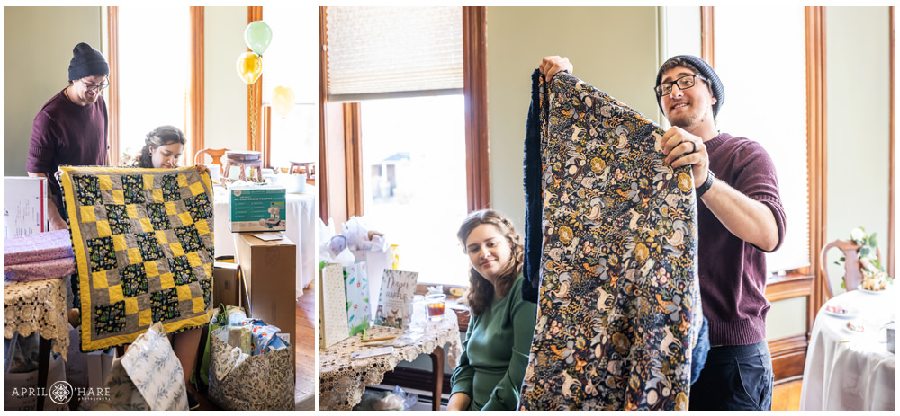 Couple show off their new baby blankets at their Denver Baby Shower at Lumber Baron Inn