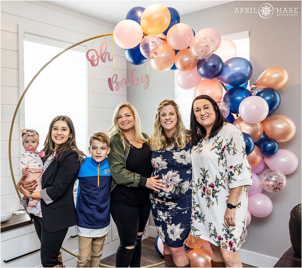 Friend photo with the blue and pink balloon arch at a Colorado Baby Shower