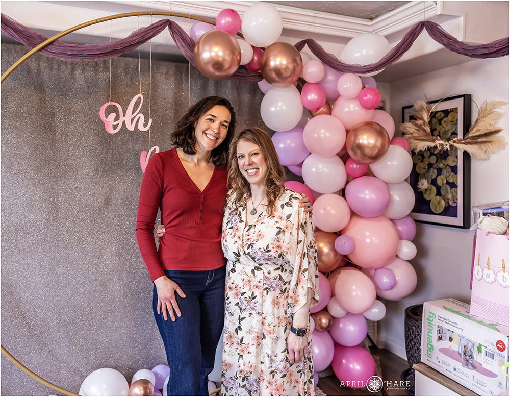 Photos with guests at a purple and pink baby shower in Denver Colorado