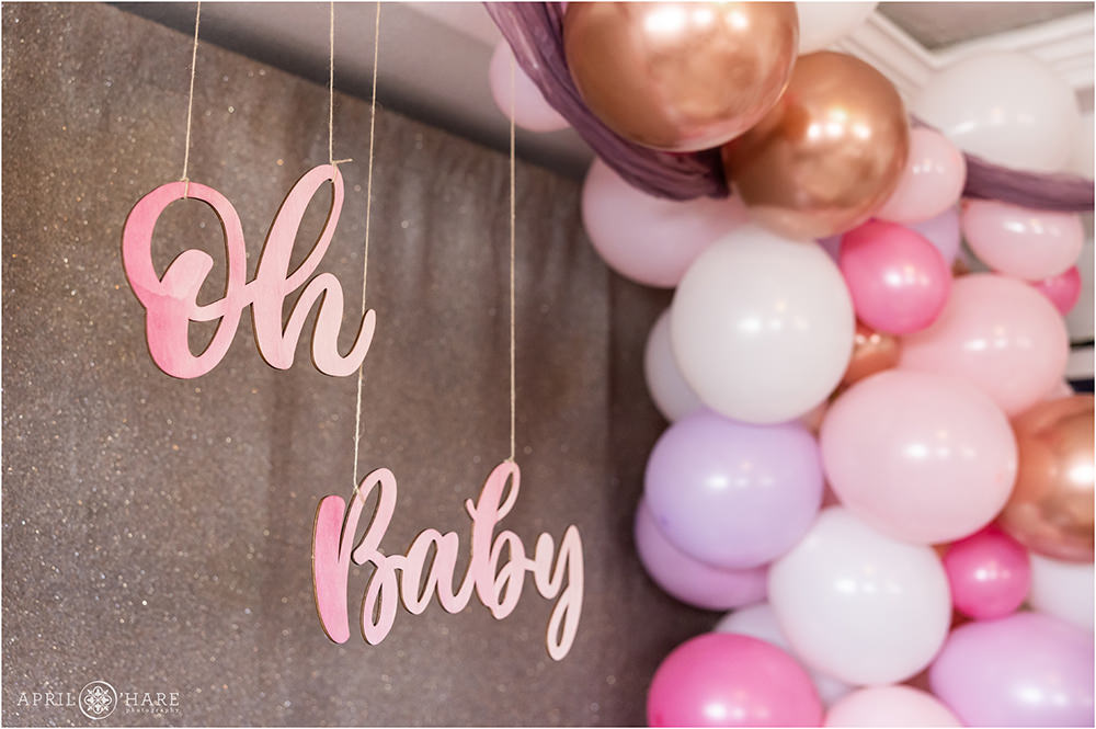 Oh Baby wood sign with the purple and pink balloon arch at a Denver Baby Shower