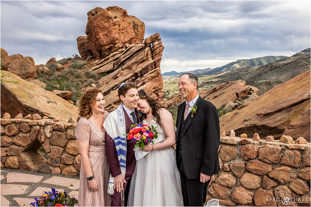 Candid moment as a family laughs together during portraits at a Red Rocks wedding