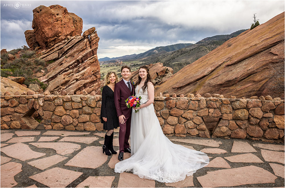 Bride and groom with Groom's mom family portrait at Red Rocks