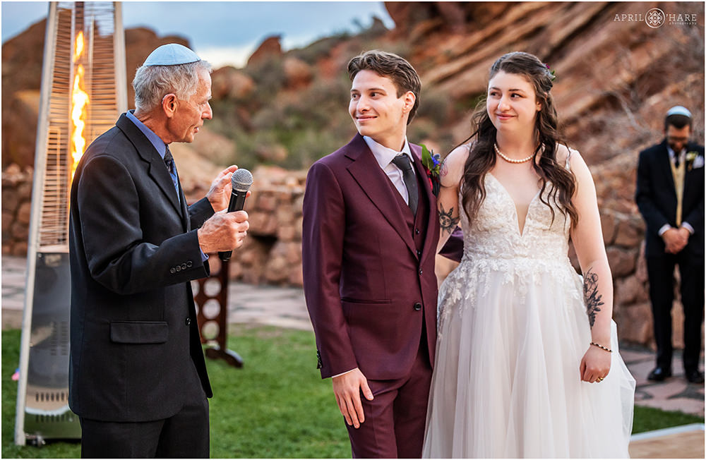 Groom's grandfather gives a blessing on his wedding day at Red Rocks Trading Post Backyard