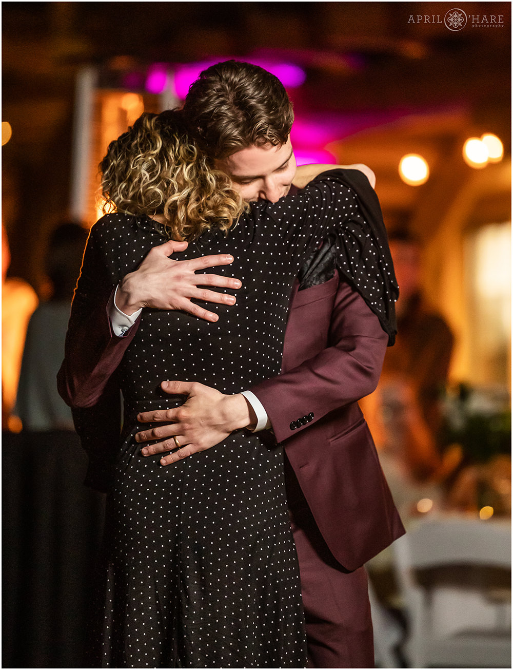 Groom and his mom hug after their dance at Red Rocks Trading Post Backyard wedding reception