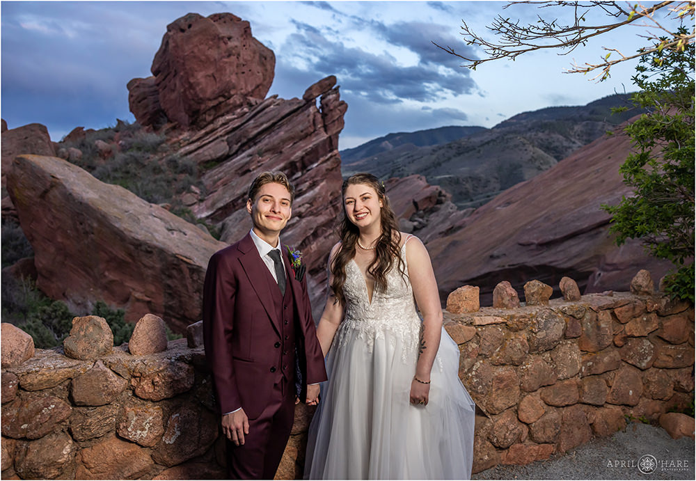 Bride and groom best friends holding hands on their wedding day at Red Rocks Trading Post Backyard