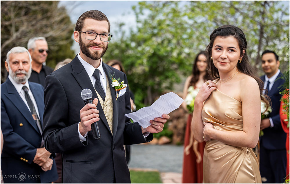 Best man and maid of honor do a reading at a Red Rocks wedding ceremony