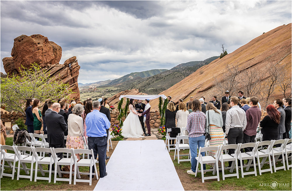 Jewish wedding ceremony under the huppah at Red Rocks in Colorado