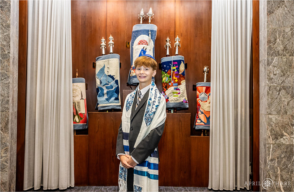 Bar Mitzvah Boy Portrait in front of Torahs at Temple Sinai
