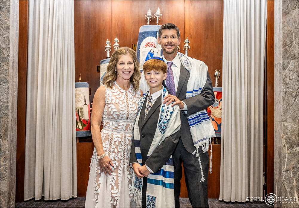 Bar Mitzvah Boy poses for portrait with his parents at Temple Sinai