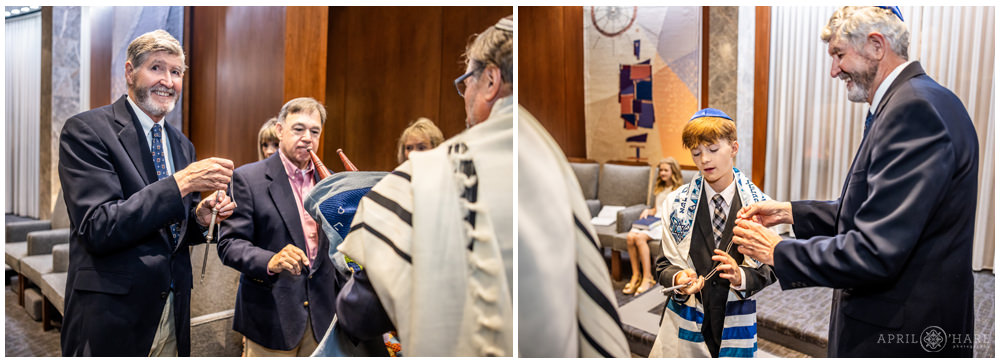 Grandparents help with the Torah at their grandson's bar mitzvah at Temple Sinai in Denver