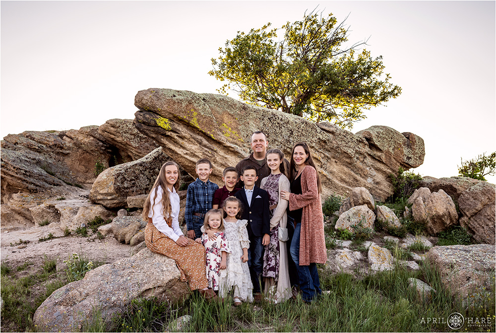 Beautiful family portrait on the pretty scenery of their family farm in Franktown Colorado