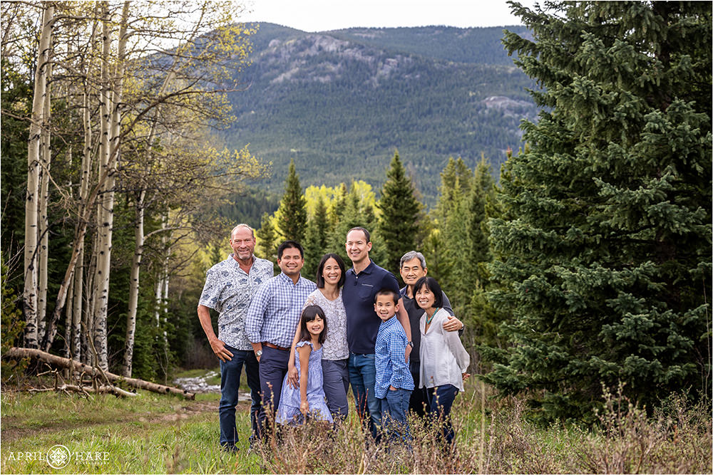 Family group photo with a mountain backdrop on Squaw Pass Road in Evergreen Colorado