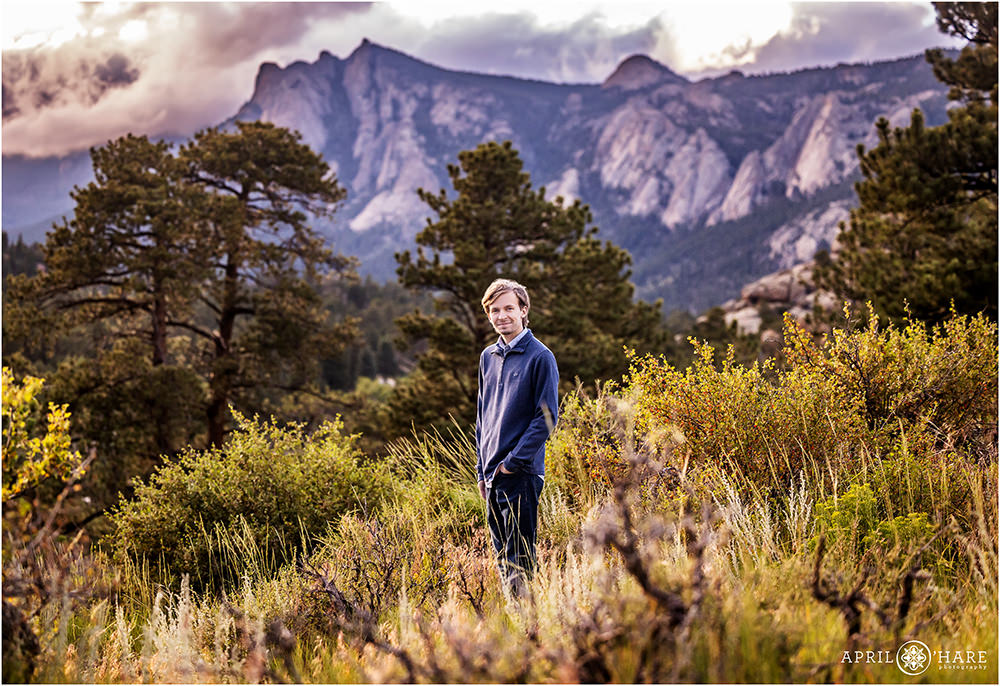 High School Senior Portrait with dramatic mountain backdrop in Estes Park Colorado