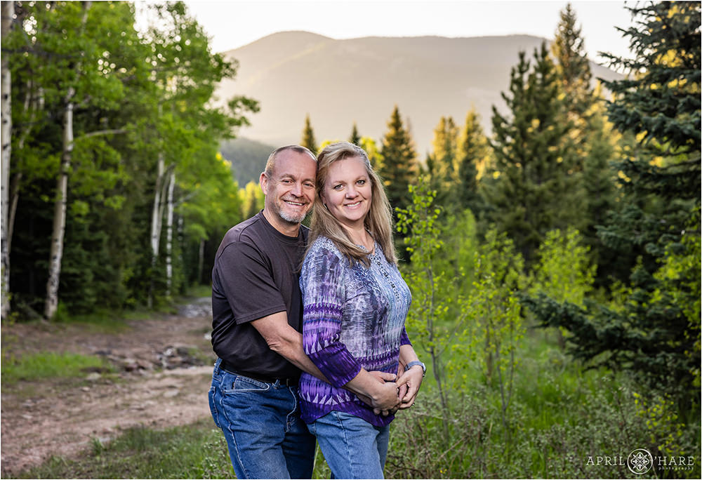 Married couple get a photo in a mountain meadow in Evergreen Colorado