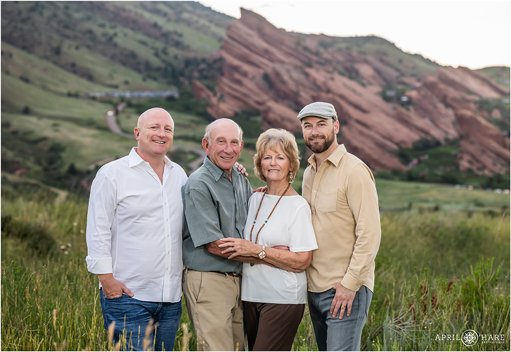 Parents pose for a photo with their two adult sons at East Mount Falcon Trailhead in Morrison Colorado