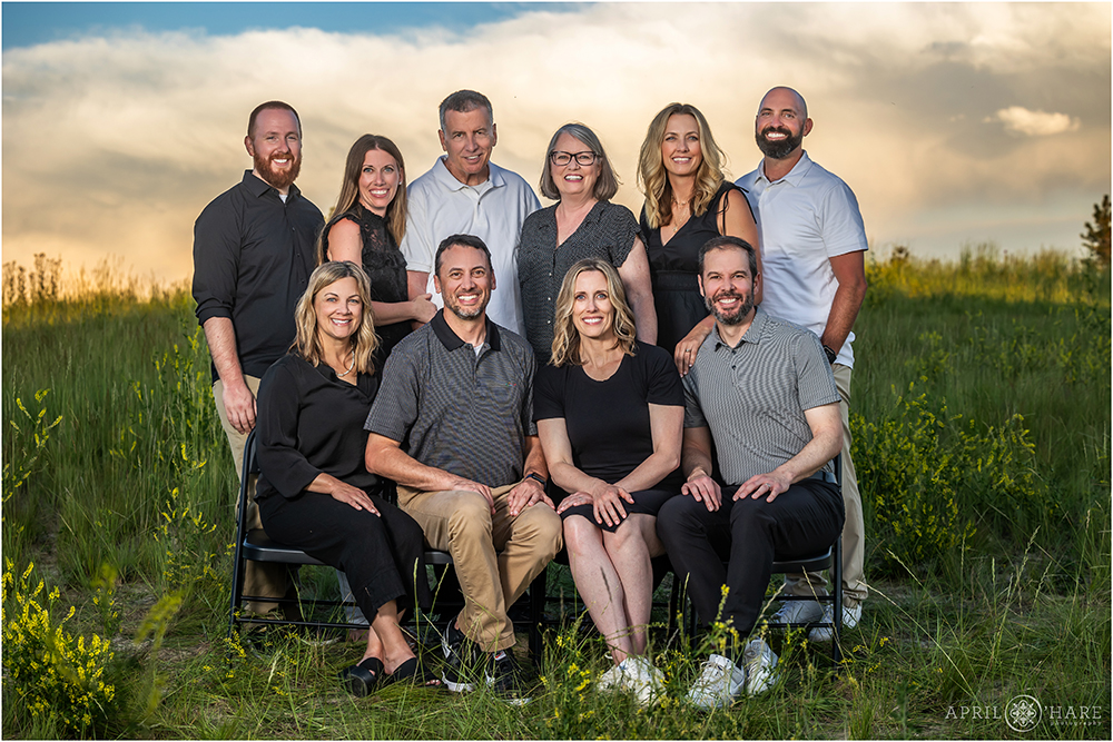Adult siblings and their spouses all get a photo together at their extended family photography session in Aurora Colorado