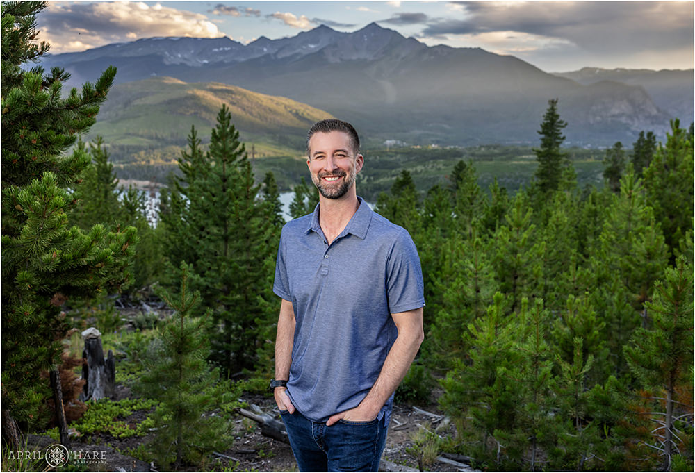 Colorado portrait of a man standing in front of a beautiful mountain backdrop in Summit County Colorado