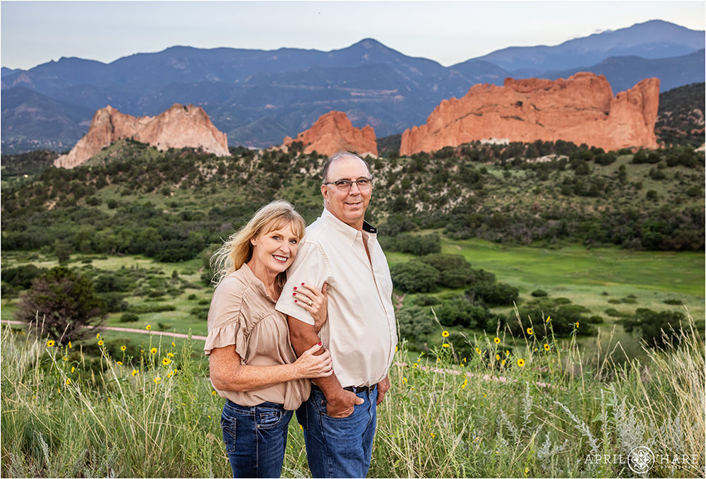 Beautiful scenery with wild sunflowers and Garden of the Gods in the backdrop at a Colorado Springs family session
